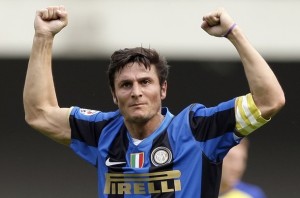 Inter Milan's Zanetti celebrates after a goal scored by his teammate Balotelli against Chievo during their Italian Serie A soccer match at the Bentegodi Stadium in Verona